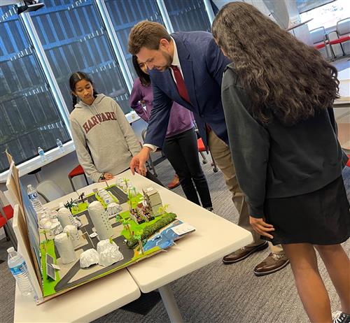 Students answering questions about their future city model